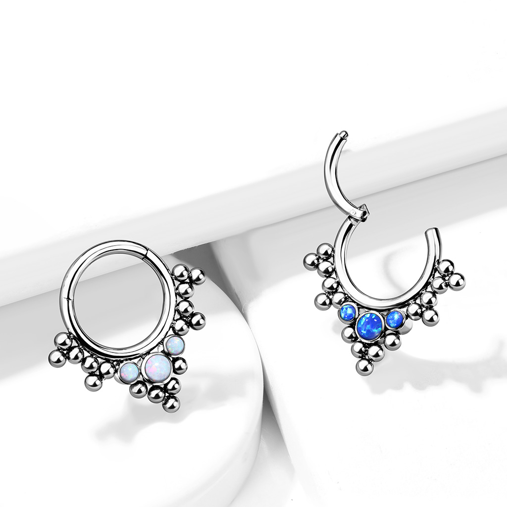 Hinged ring made of titanium with clustered beads and opals