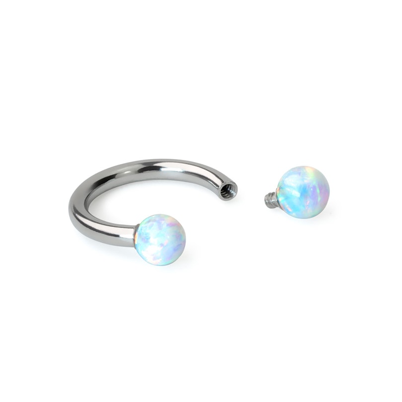 Circular barbell with internally threaded opal stones